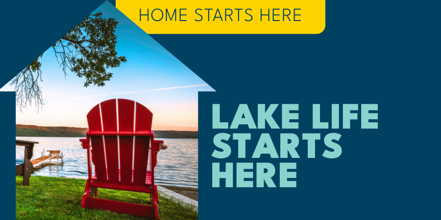 Red adirondack chair by lake